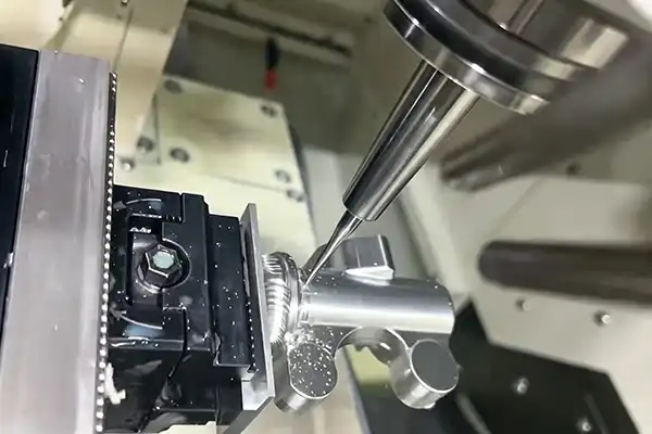 CNC machining of aluminum automotive component with coolant in process