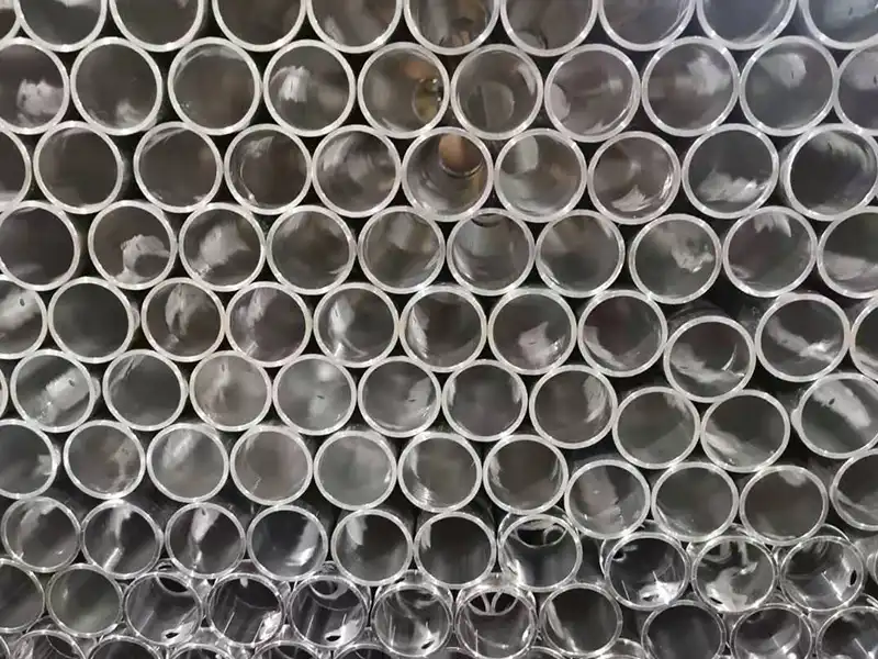 Aluminum tube sections prepared for fall protection system fabrication