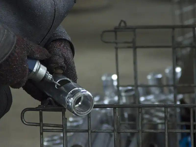 Surface grinding an aluminum link arm component before welding
