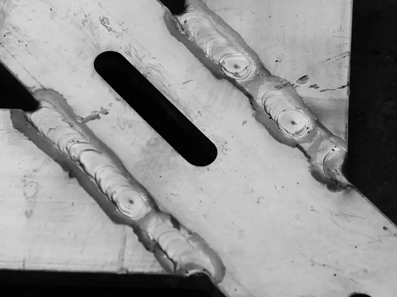 Close-up of welded plate connection on aluminum component