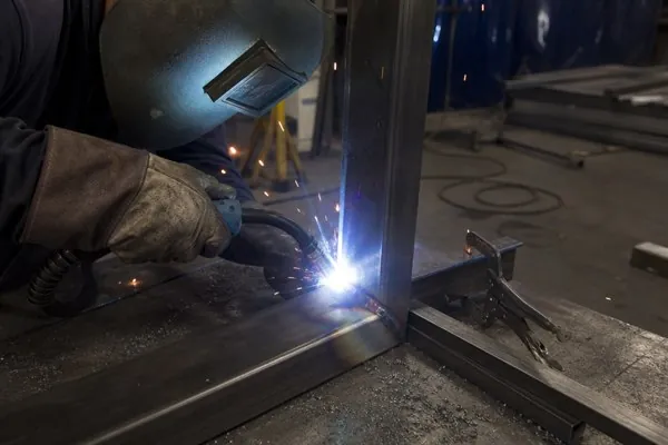 Robotic MIG welding at the tube joint of an industrial automation frame at Conwhole